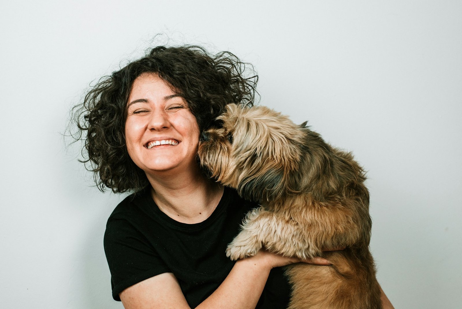 Real dog owner sharing a close moment with her dog
